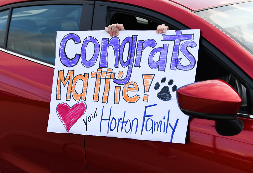 Well-wishers decorated vehicles and made signs
